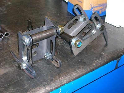The complete pair of brackets, as delivered, with all hardware and spreader tube.